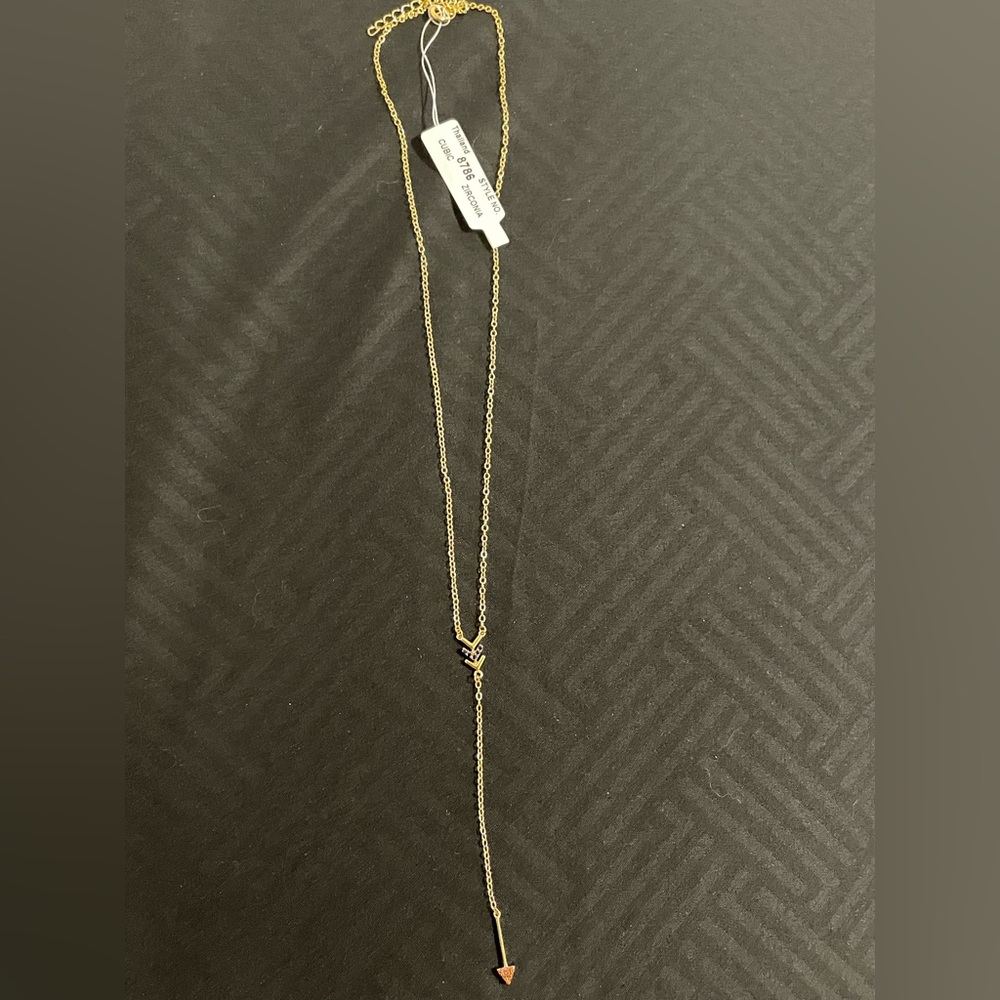 Gold necklace with arrow